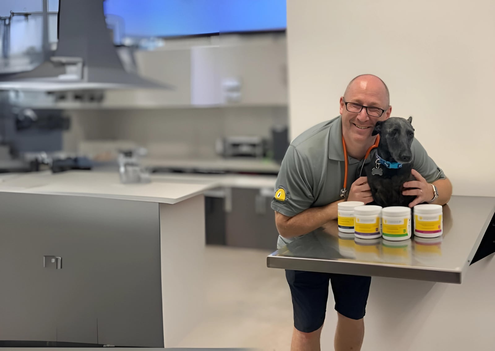 Dr. Josh Sosnow at his veterinary clinic with all four strengths of Companion CBD soft chews
